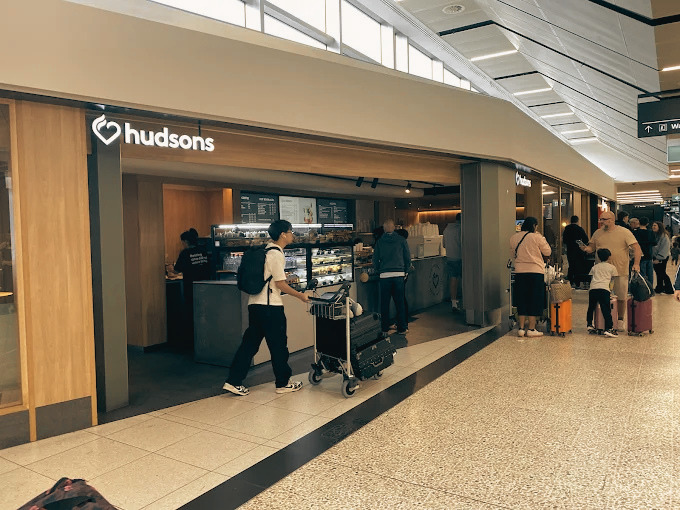 Melbourne Airport Terminal 2 international arrivals — chauffeur meeting point at Hudson's Coffee